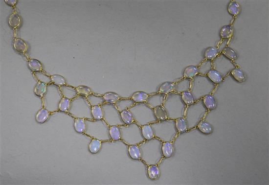 A 14ct gold and white opal fring necklace, 42cm.